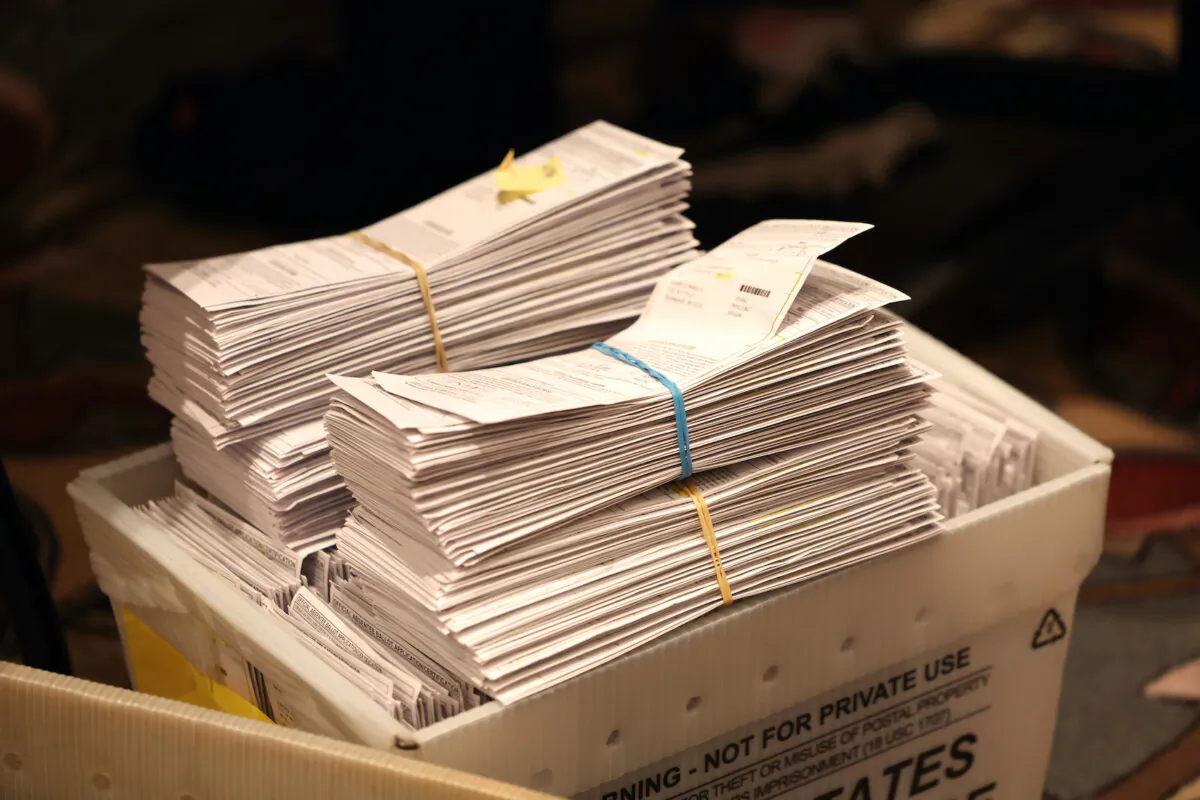 Election ballots are shown as workers count mail-in and in-person absentee ballots at the Wisconsin Center in Milwaukee, Wis., on Nov. 8, 2022. (Scott Olson/Getty Images)