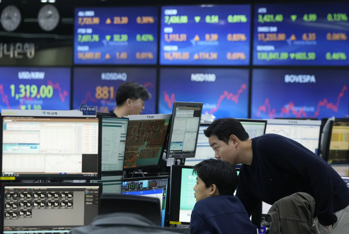 Currency traders watch monitors at the foreign exchange dealing room of the KEB Hana Bank headquarters in Seoul, South Korea, on Jan. 11, 2024. (Ahn Young-joon/AP Photo)