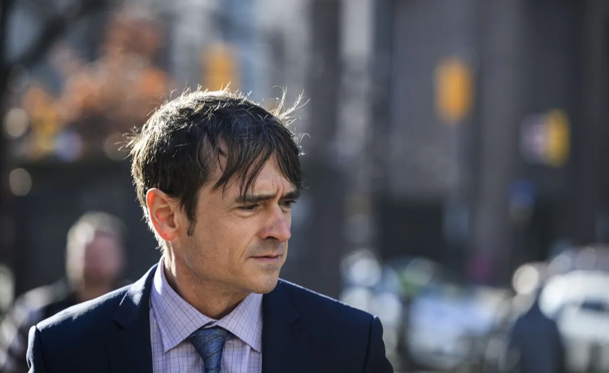 Cameron Jay Ortis, a former RCMP intelligence official charged with breaching Canada's secrets law, arrives for his trial at the courthouse in Ottawa, on Nov. 16, 2023. (The Canadian Press/Justin Tang)