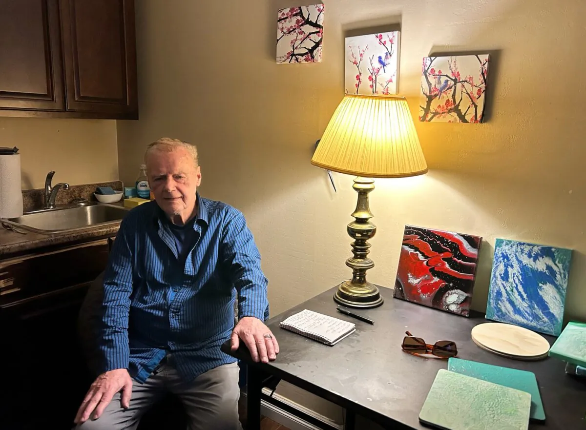 Walter Gillespie poses for a photo in his apartment in Saint John, N.B. on Jan. 9, 2024. (The Canadian Press/Hina Alam)