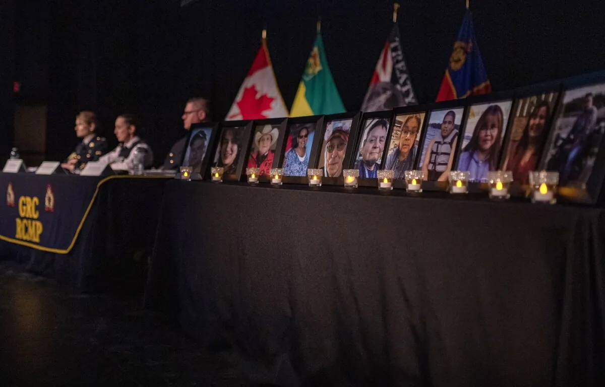 Photographs of those killed during the mass stabbing on the James Smith Cree Nation and in the nearby village of Weldon in 2022 are on display as Saskatchewan RCMP provide a preliminary timeline presentation of the events during a media event in Melfort, Sask., on April 27, 2023. (The Canadian Press/Liam Richards)