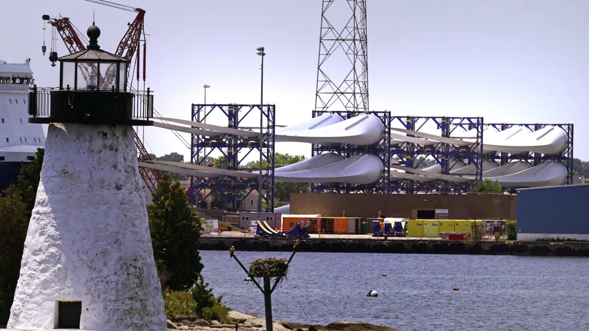 Giant wind turbine blades for the Vineyard Wind project are stacked on large racks at the harbor in New Bedford, Mass., on July 11, 2023. (Charles Krupa/AP Photo)