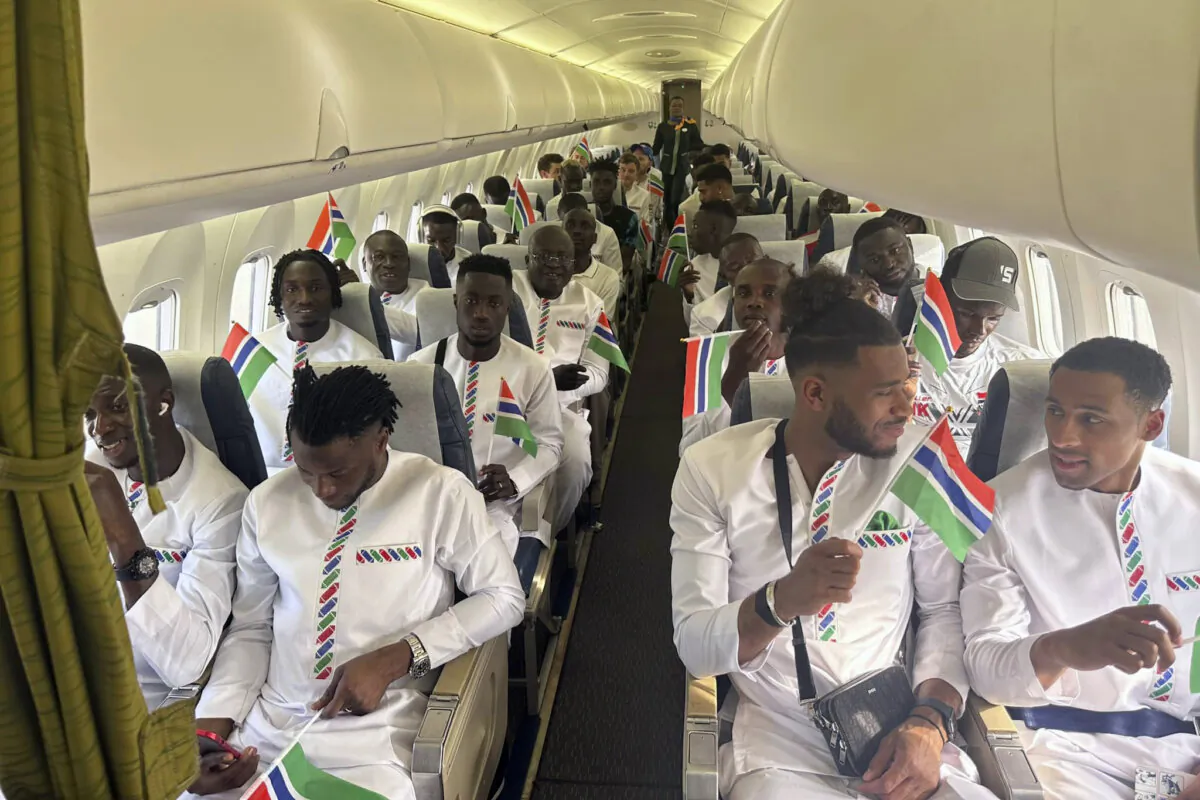 The Gambia national soccer team aboard a plane in Banjul, Gambia, on Jan. 10, 2024. (Gambia Football Federation via AP)