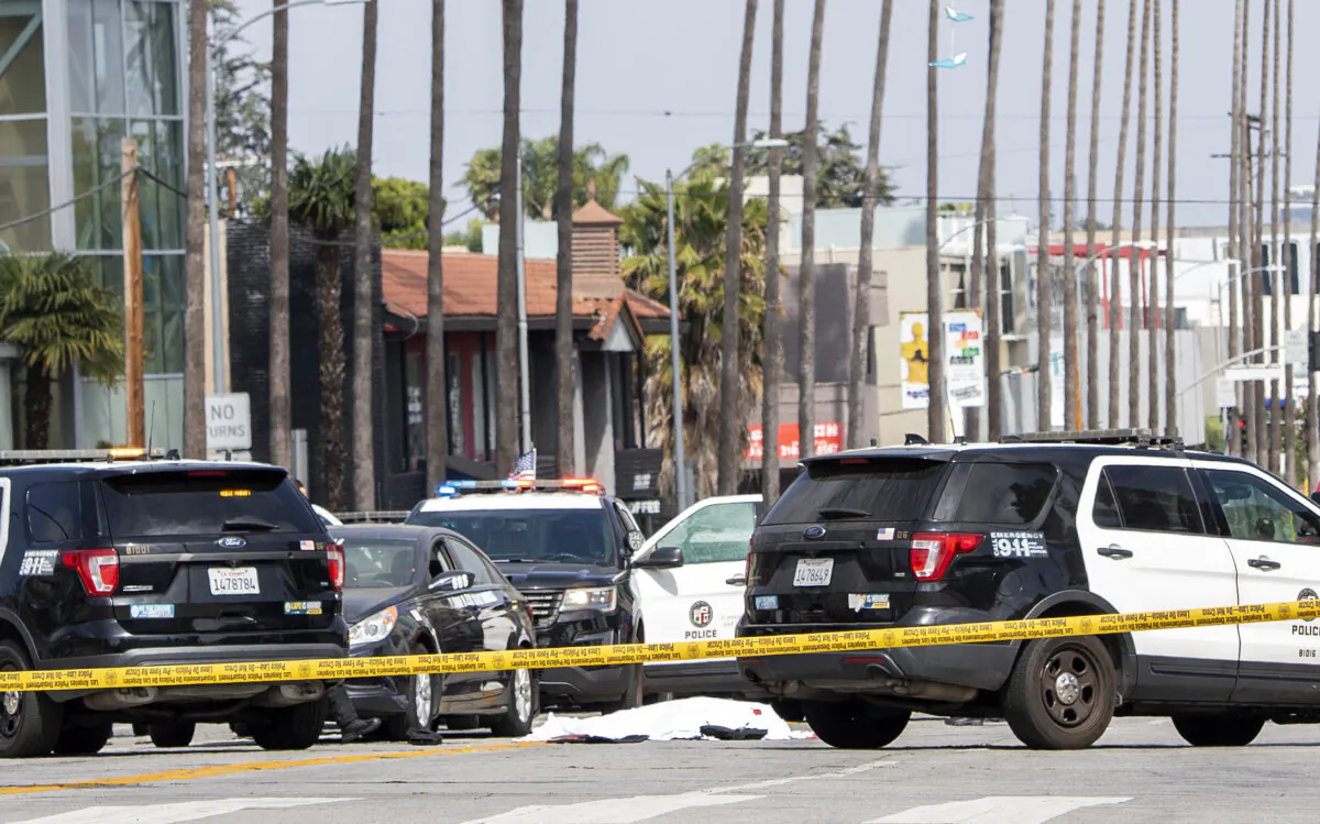 Police cars block traffic at a crime scene in a file photo in Los Angeles. (Valerie Macon/AFP via Getty Images)