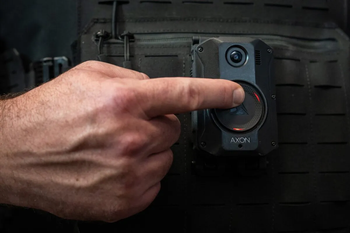 A Delta Police Department officer demonstrates recording on a body camera during a news conference by the B.C. Association of Chiefs of Police about implementing body-worn cameras for officers, in Surrey, B.C., on Jan. 11, 2024. (The Canadian Press/Ethan Cairns)