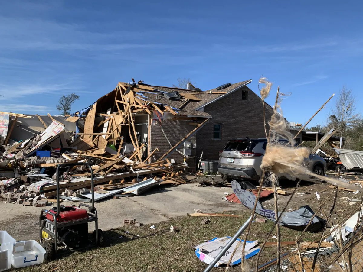 A home sits in disarray after being hit by an EF2 tornado in Bayhead, Fla., on Jan. 10, 2024. (T.J. Muscaro/The Epoch Times).