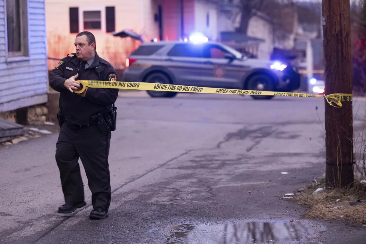 A Pennsylvania State Trooper blocks off the 400 block of North Decker Court after a Scranton police officer was shot in Scranton, Pa., on Jan. 11, 2024. (Christopher Dolan/The Times-Tribune via AP)