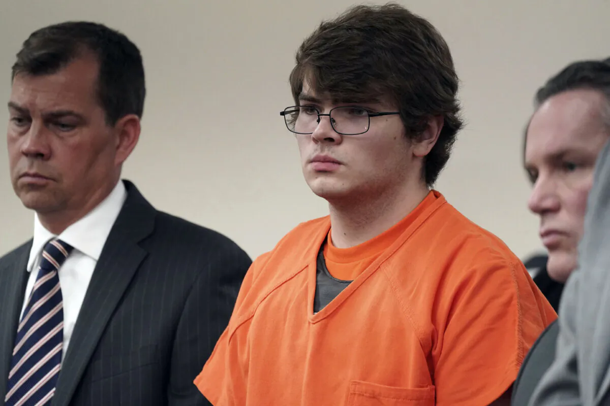 Payton Gendron (C) listens as he is sentenced to life in prison without parole for domestic terrorism motivated by hate and each of the 10 counts of first-degree murder in an Erie County court room in Buffalo, N.Y., on Feb. 15, 2023. (Derek Gee/The Buffalo News via AP, Pool)