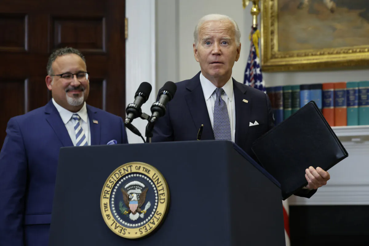 U.S. President Joe Biden is joined by Education Secretary Miguel Cardona (L) at a press conference in the White House on June 30, 2023 (Chip Somodevilla/Getty Images)