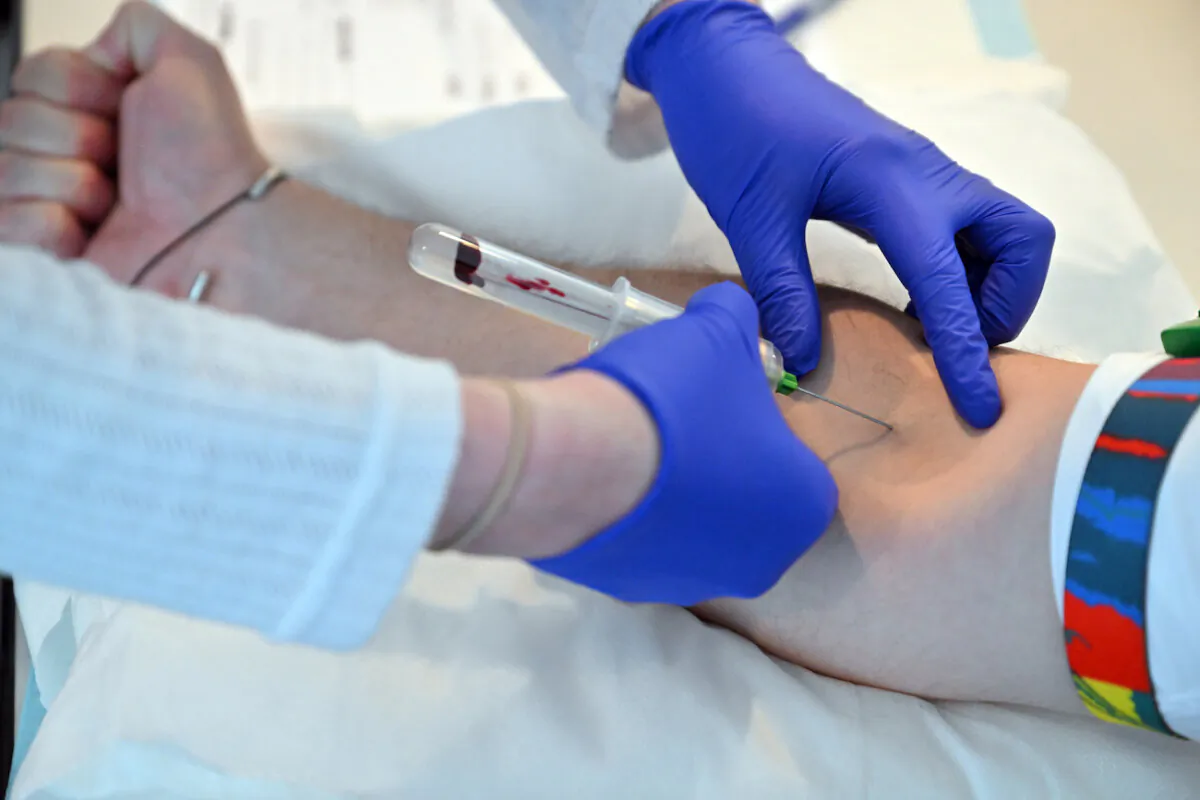 A man has a blood test taken to screen for prostate cancer at Parliament House in Canberra, Nov. 16, 2023. Nubeqa (darolutamide) will be expanded on the Pharmaceutical Benefits Scheme to treat patients with metastatic hormone-sensitive prostate cancer (mHSPC). (AAP Image/Mick Tsikas)