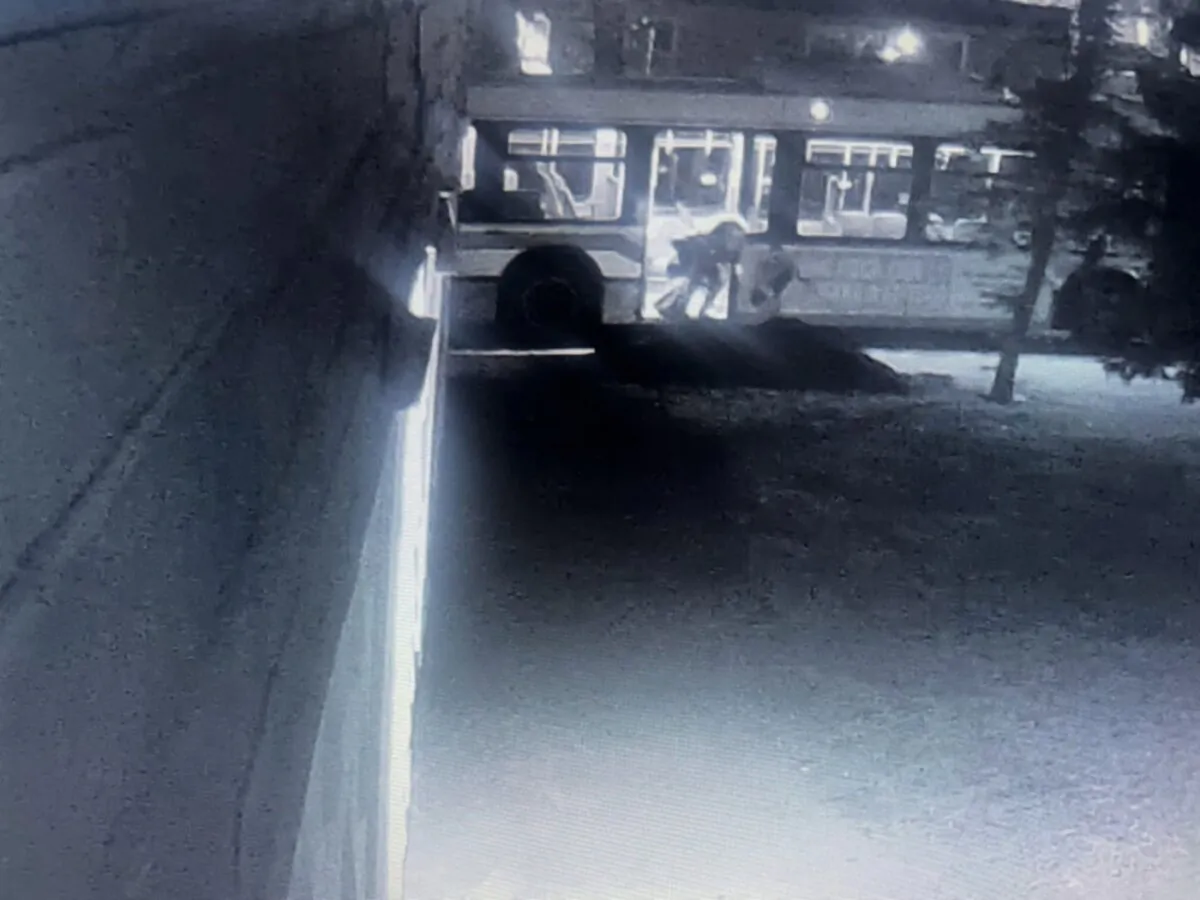 Security camera footage from Flatlander Express shows a man fall from a bus in Regina. (The Canadian Press/HO-Jeff Holt)