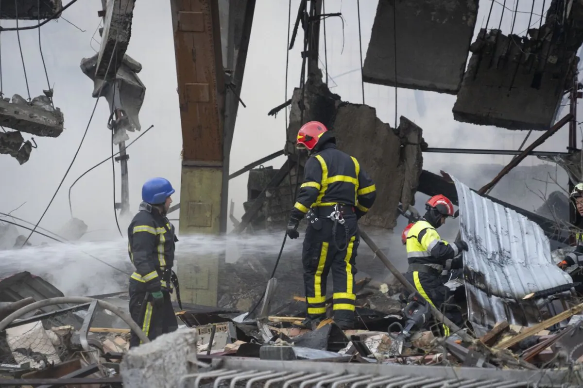 Firefighters put out a fire after a Russian rocket attack in Kyiv, Ukraine, on Aug. 30, 2023. (The Canadian Press/AP-Efrem Lukatsky)