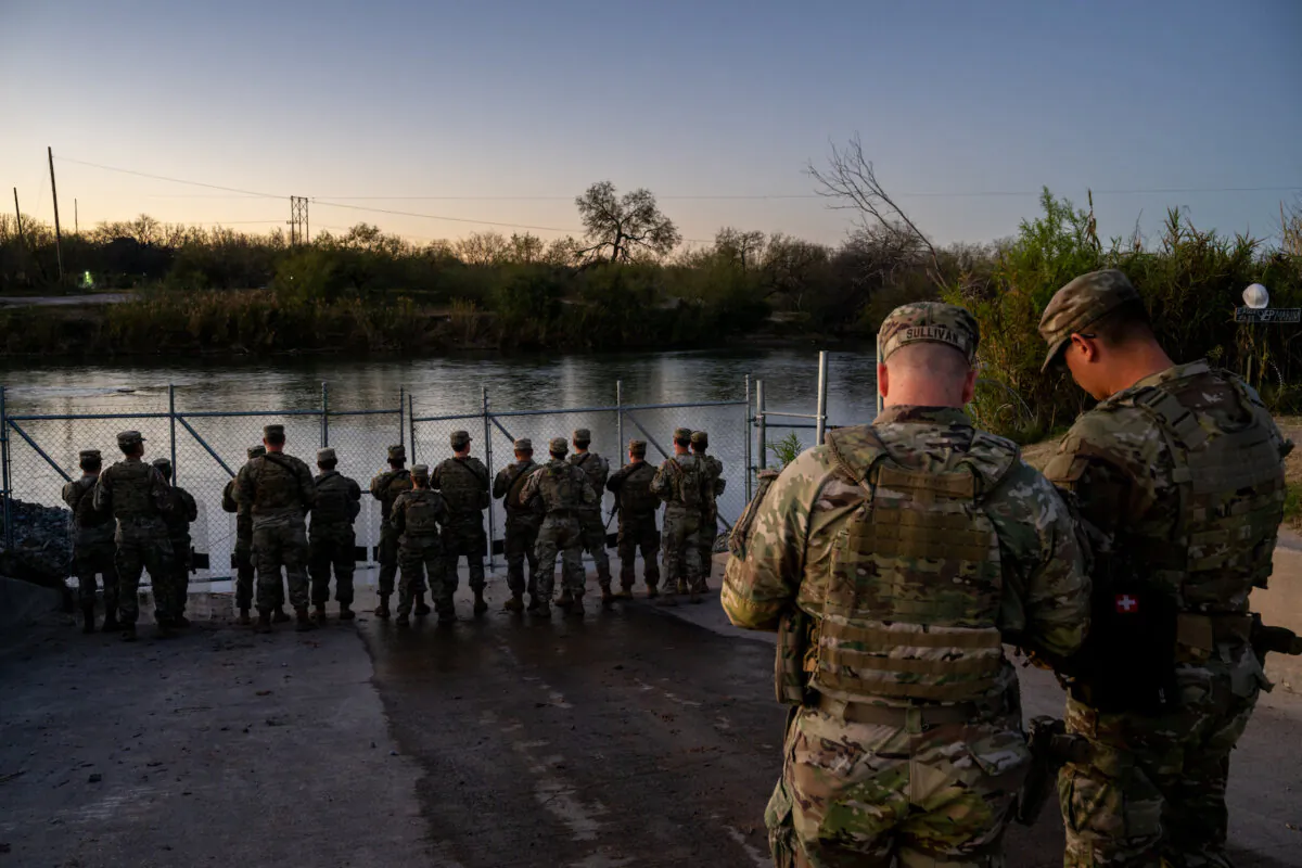 National Guard soldiers stand watch on the banks of the Rio Grande river at Shelby Park in Eagle Pass, Texas, on Jan. 12, 2024. (Brandon Bell/Getty Images)