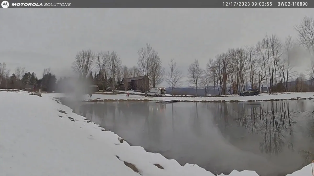 This body cam image shows a pond just after a Vermont State Police trooper rescued a girl who had fallen through thin ice on the waterway, in Cambridge, Vt., on Dec. 17, 2023. (Vermont State Police via AP)