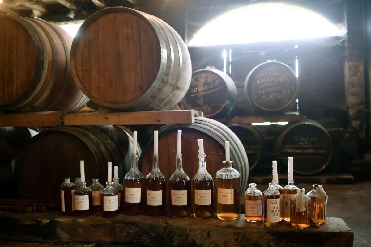 The oak barrels, decanters and bottles are stored in the cellers of Chateau Laballe (Bas-Armagnac appellation), where Armagnac is produced in Parleboscq, in southwestern France on Sept. 6, 2023. (Gaizka Iroz/AFP via Getty Images)