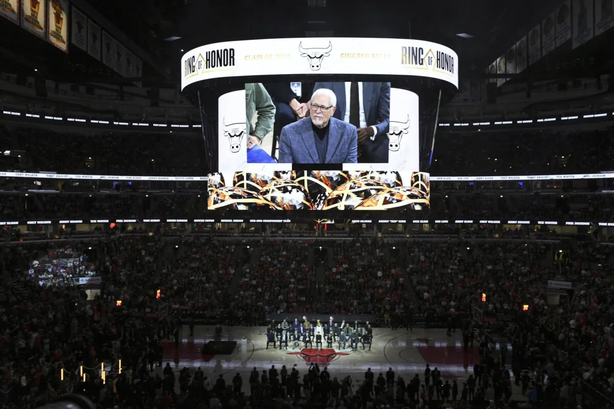Former Chicago Bulls coach Phil Jackson is seen on a video screen during a Ring of Honor ceremony for the 1995–96 Bulls team, during halftime of an NBA basketball game between the Bulls and the Golden State Warriors in Chicago on Jan. 12, 2024. (Paul Beaty/AP Photo)