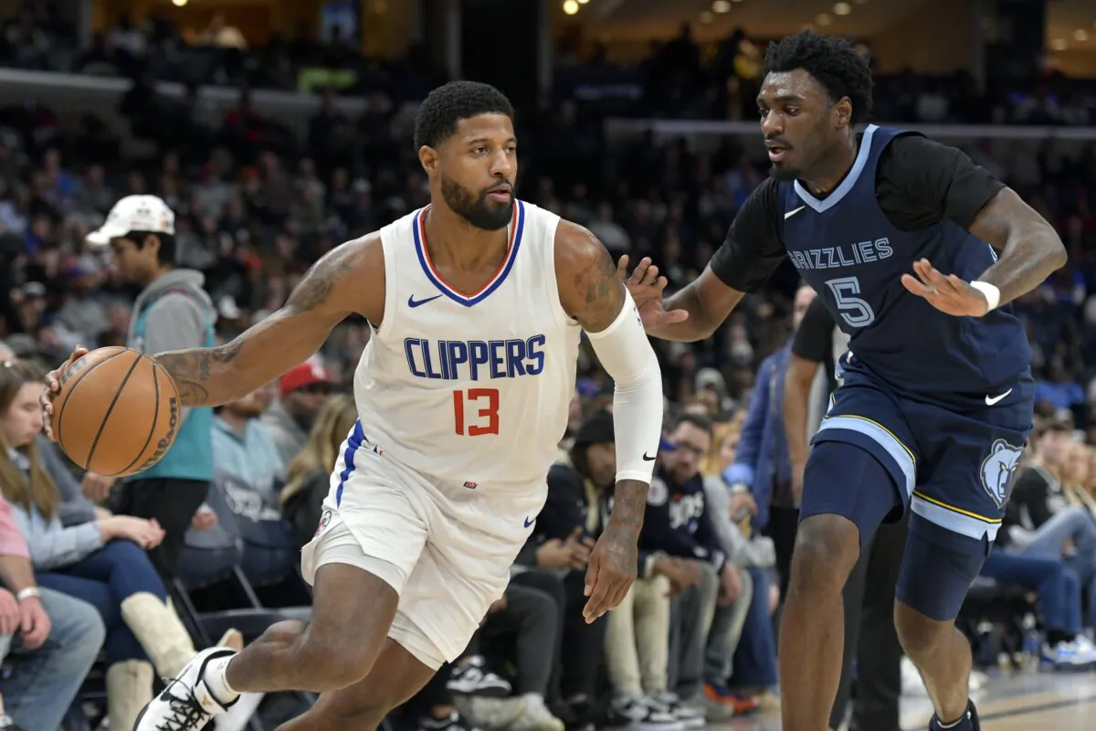 Los Angeles Clippers forward Paul George (13) drives against Memphis Grizzlies guard Vince Williams Jr. (5) during the first half of an NBA basketball game in Memphis, Tenn., on Jan. 12, 2024. (Brandon Dill/AP Photo)