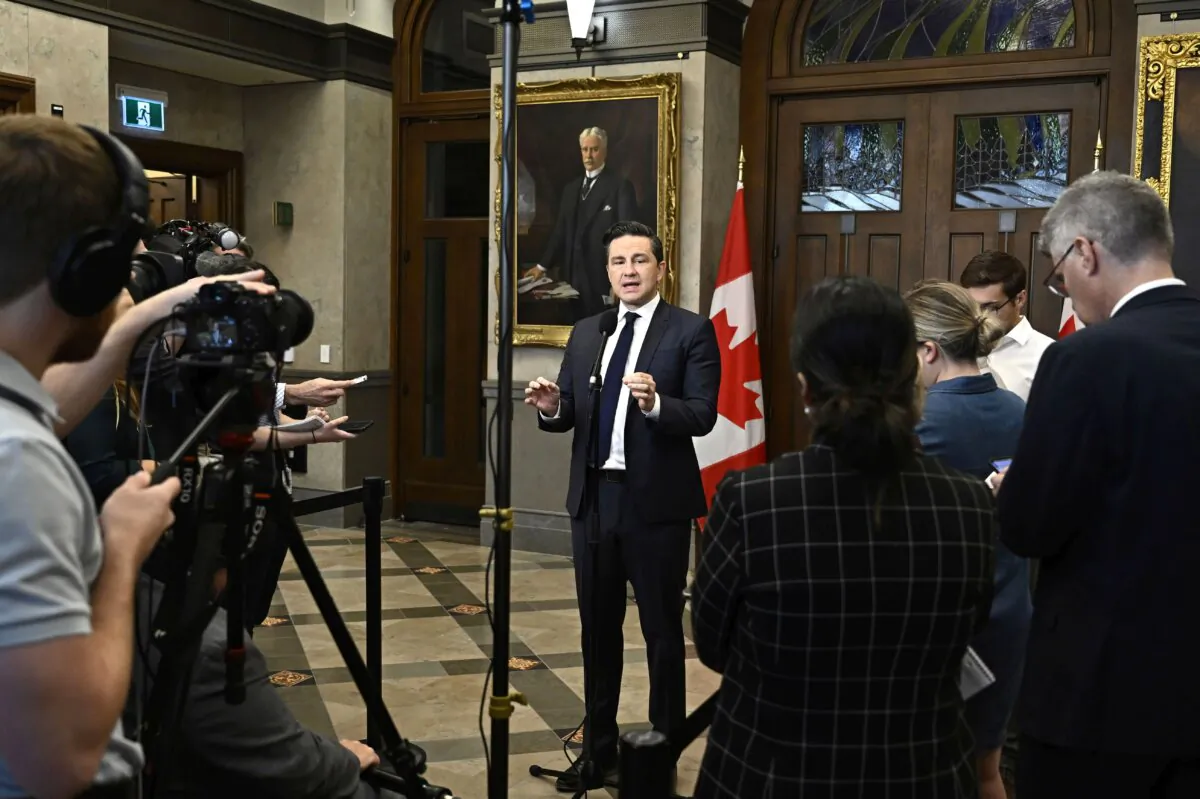 Conservative Leader Pierre Poilievre speaks to reporters in the foyer of the House of Commons on Parliament Hill in Ottawa on Oct. 3, 2023. (The Canadian Press/Justin Tang)