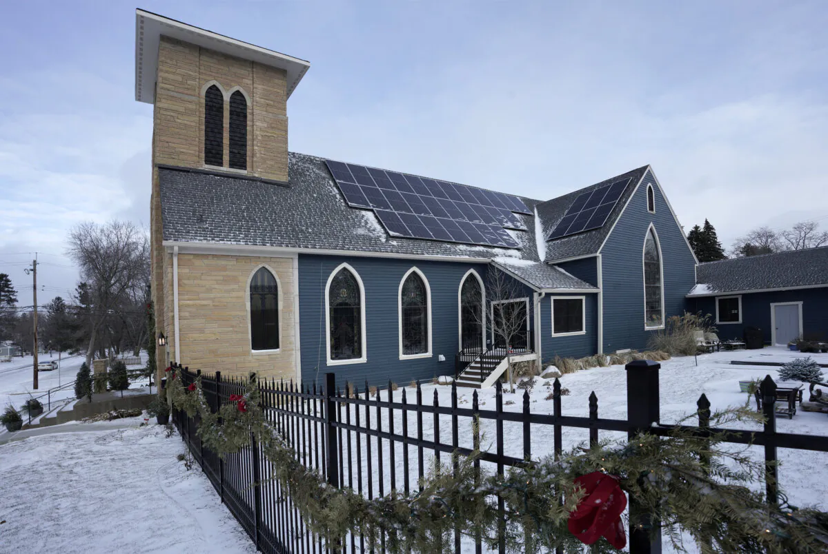 The oldest surviving church building in White Bear Lake had long been home to the Lakeshore Players until the community theater group relocated a few years ago. In 2018, it was slated for demolition by a developer. Kelly Clement and Steve Bucher, both avid musicians outside of their day jobs, turned the 7,800-square-foot property into their dream home, complete with a performance space for jam sessions. Seen Thursday, Dec. 16, 2021, in White Bear Lake, Minnesota. (Brian Peterson/Minneapolis Star Tribune/TNS)