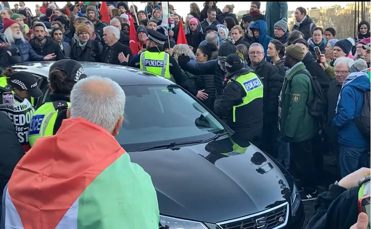 Handout screengrab from a video issued by Jim Orr of a car involved in an incident with people taking part in a Scottish Palestine Solidarity Campaign demonstration at The Mound, Edinburgh, on Jan. 13, 2024. (Jim Orr/PA Wire)