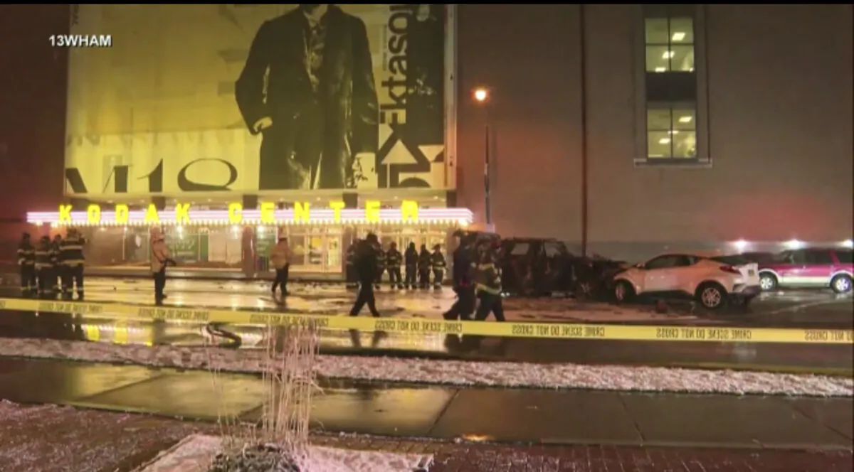 Rochester police investigate a fatal fiery crash outside the Kodak Center in Rochester, N.Y., on Jan. 1, 2024. (WHAM-TV via AP)