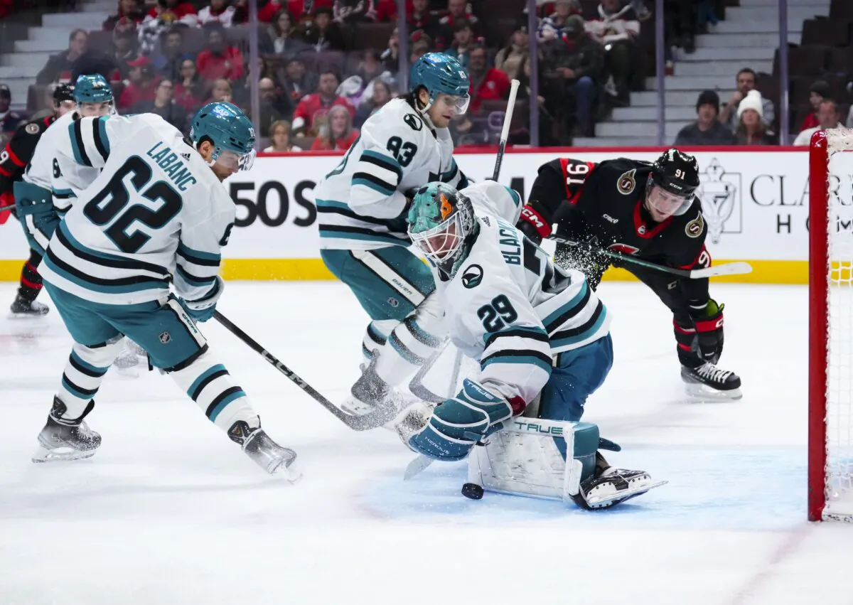 San Jose Sharks goaltender Mackenzie Blackwood (29) makes a pad save while taking on the Ottawa Senators during the second period of an NHL hockey game in Ottawa on Jan. 13, 2024. (Sean Kilpatrick/The Canadian Press via AP)