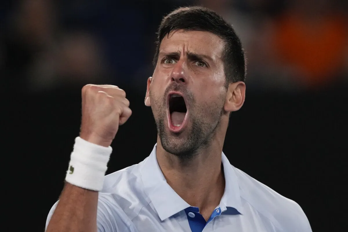Serbia's Novak Djokovic celebrates after winning the third set against Croatia's Dino Prizmic during their first round match at the Australian Open tennis championships at Melbourne Park in Melbourne, Australia, on Jan. 14, 2024. (Andy Wong/AP Photo)