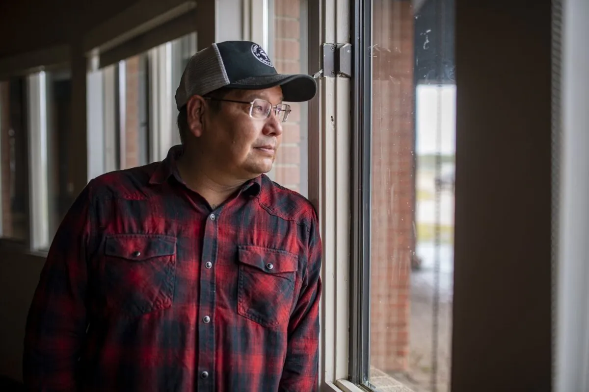 Chief Wally Burns stands for a photograph in a classroom at the school on James Smith Cree Nation on Sept. 20, 2022. (The Canadian Press/Liam Richards)