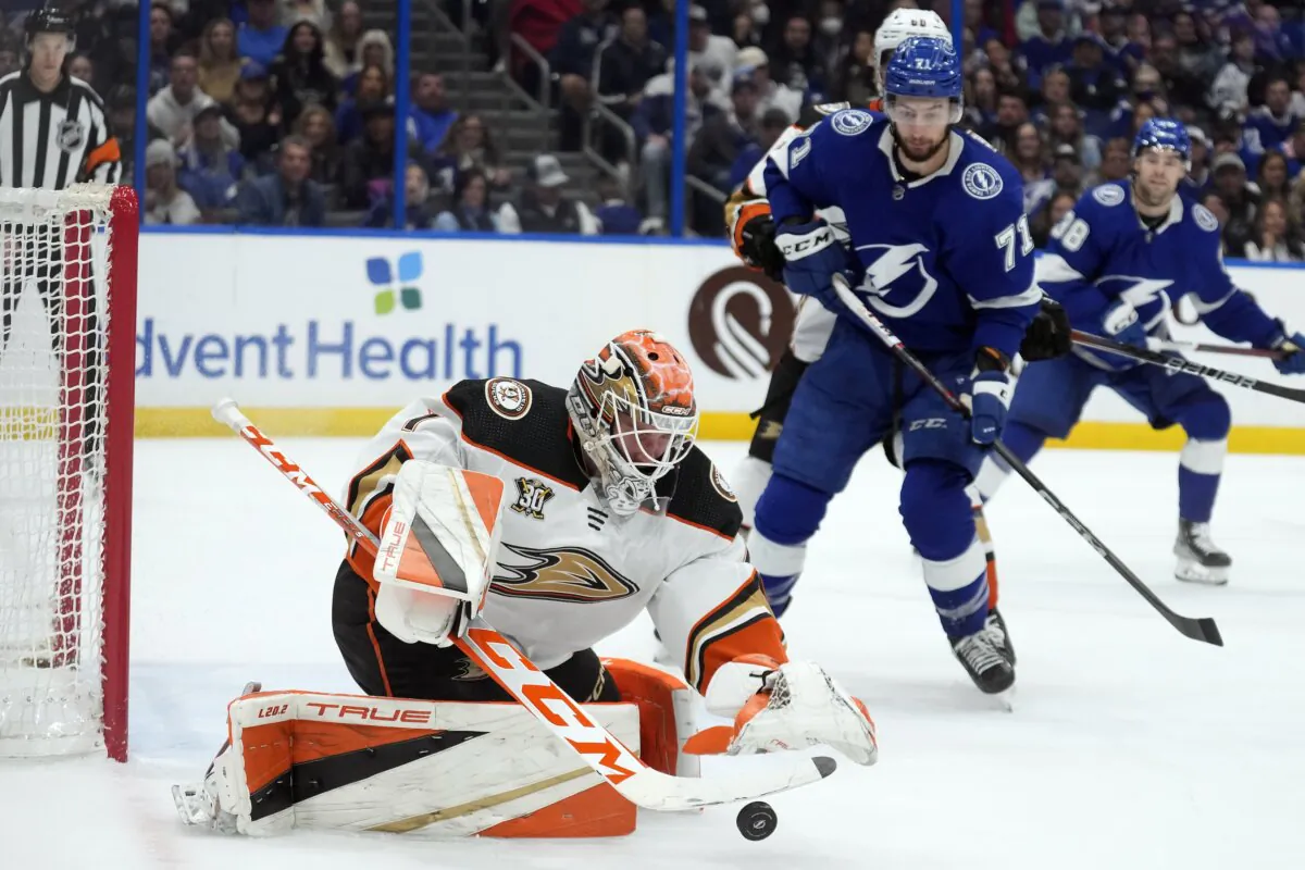 Anaheim Ducks goaltender Lukas Dostal (1) makes a save on a shot as Tampa Bay Lightning center Anthony Cirelli (71) looks for a rebound during the second period of an NHL hockey game in Tampa on Jan. 13, 2024. (Chris O'Meara/AP Photo)