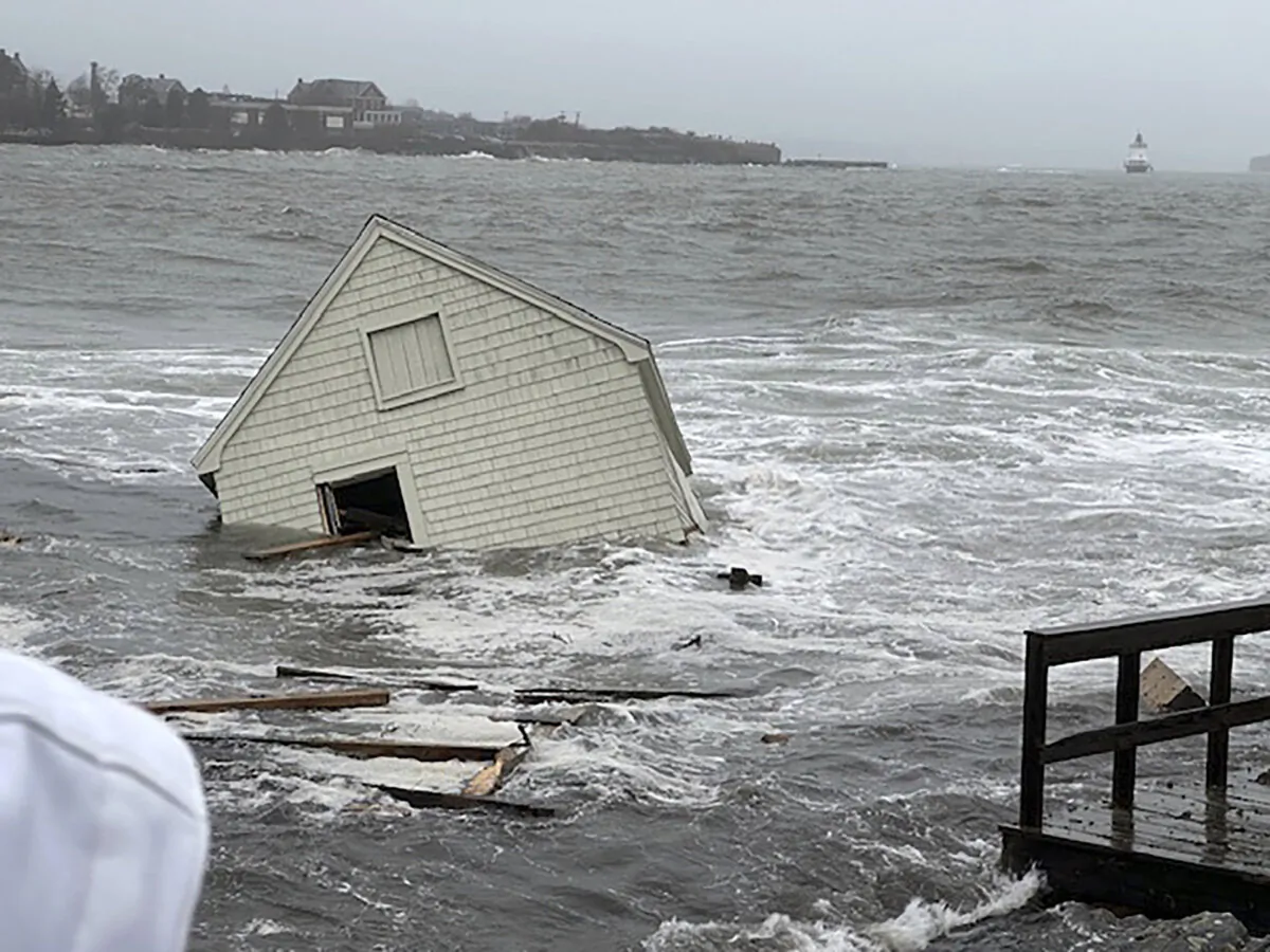 A fishing shack floats away into Casco Bay during a storm in South Portland, Maine, on Jan. 13, 2024. (Susan Young/The Bangor Daily News via AP)