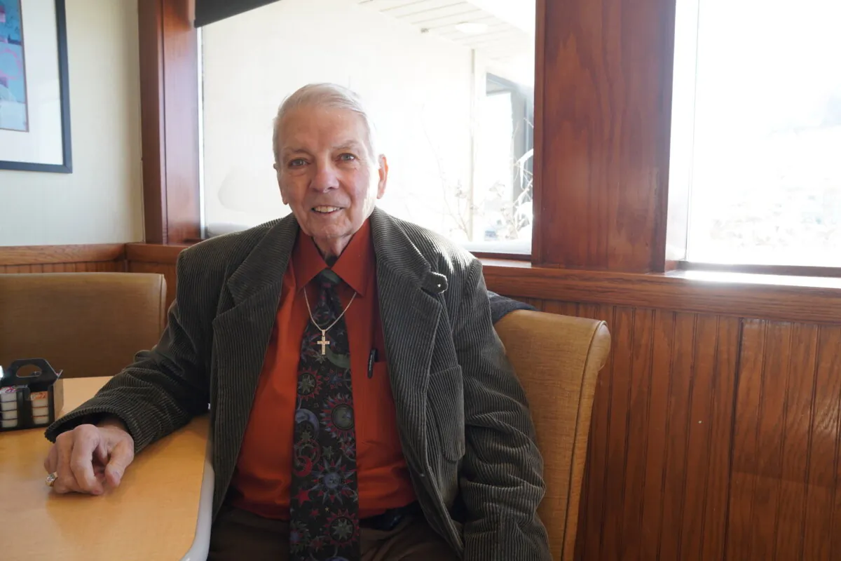 Ray Mitchem, a retired biology teacher, is going to speak out on behalf of Vivek Ramaswamy at his caucus site in Marshalltown, Iowa, on Jan. 15. On Jan. 14, he spoke about why he likes Mr. Ramaswamy while sitting in a booth at a Perkins near the interstate. (Nathan Worcester/The Epoch TImes)