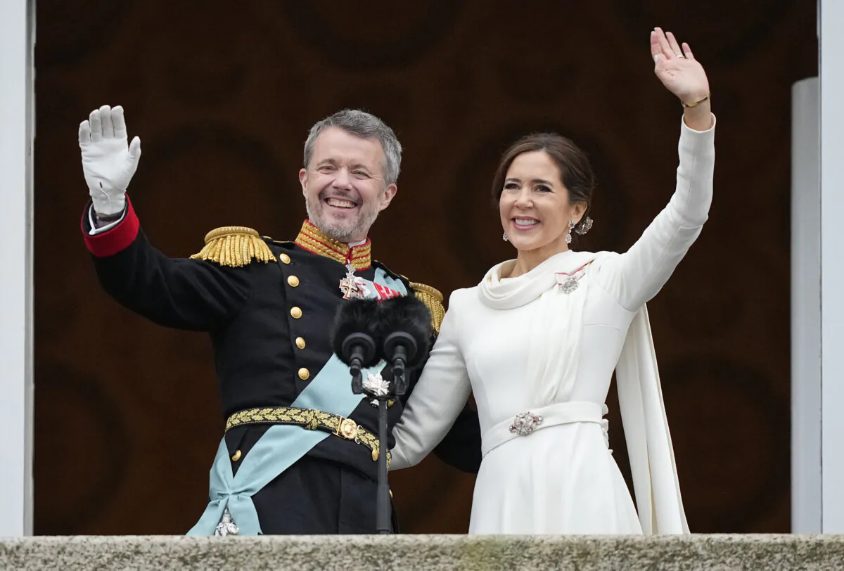 Denmark's King Frederik X and Denmark's Queen Mary wave from the balcony of Christiansborg Palace in Copenhagen, Denmark, on Jan. 14, 2024. (Martin Meissner/AP Photo)