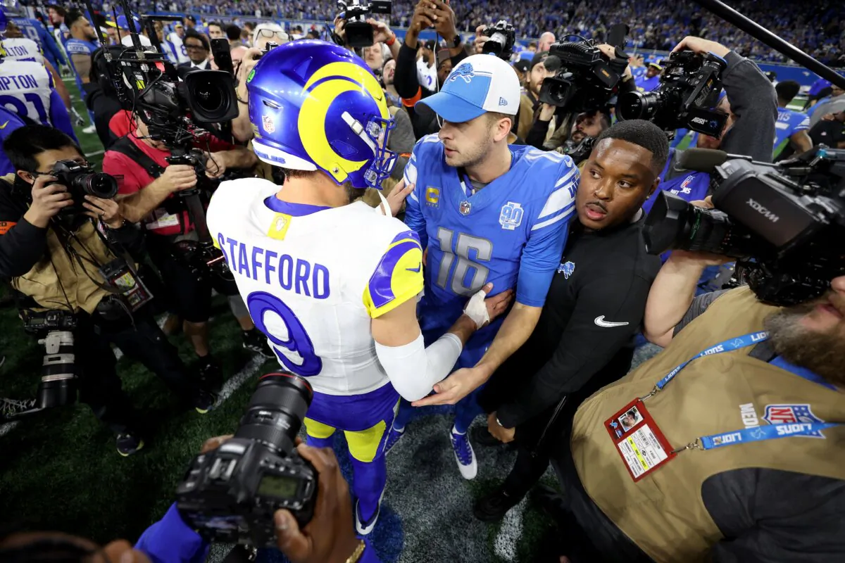 Matthew Stafford (9) of the Los Angeles Rams talks with Jared Goff (16) of the Detroit Lions following the NFC Wild Card Playoffs in Detroit on Jan. 14, 2024. (Gregory Shamus/Getty Images)