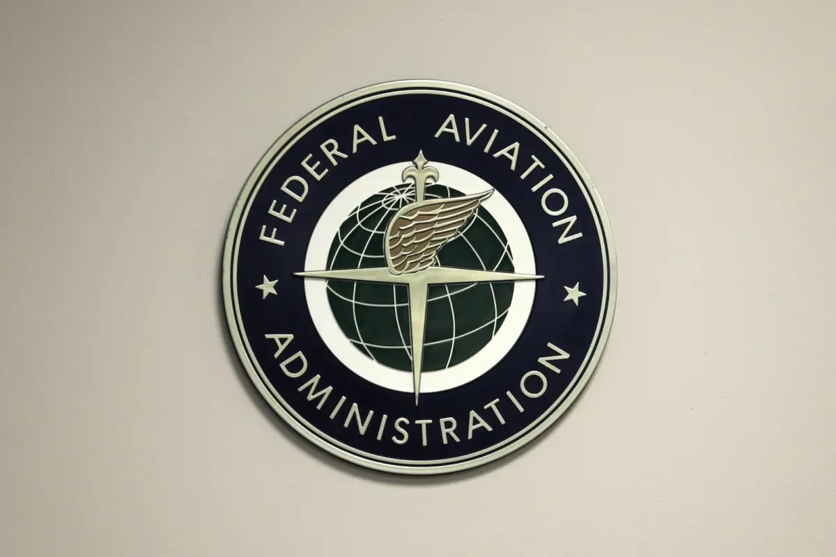 A Federal Aviation Administration sign hangs in the tower at John F. Kennedy International Airport in New York on March 16, 2017. (Seth Wenig/AP Photo)