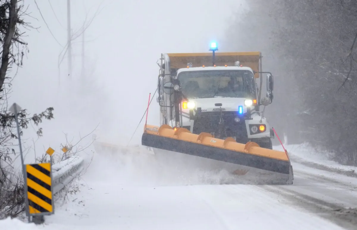 A snow plow clears a section of road in Ottawa on Jan. 9, 2024. (The Canadian Press/Sean Kilpatrick)