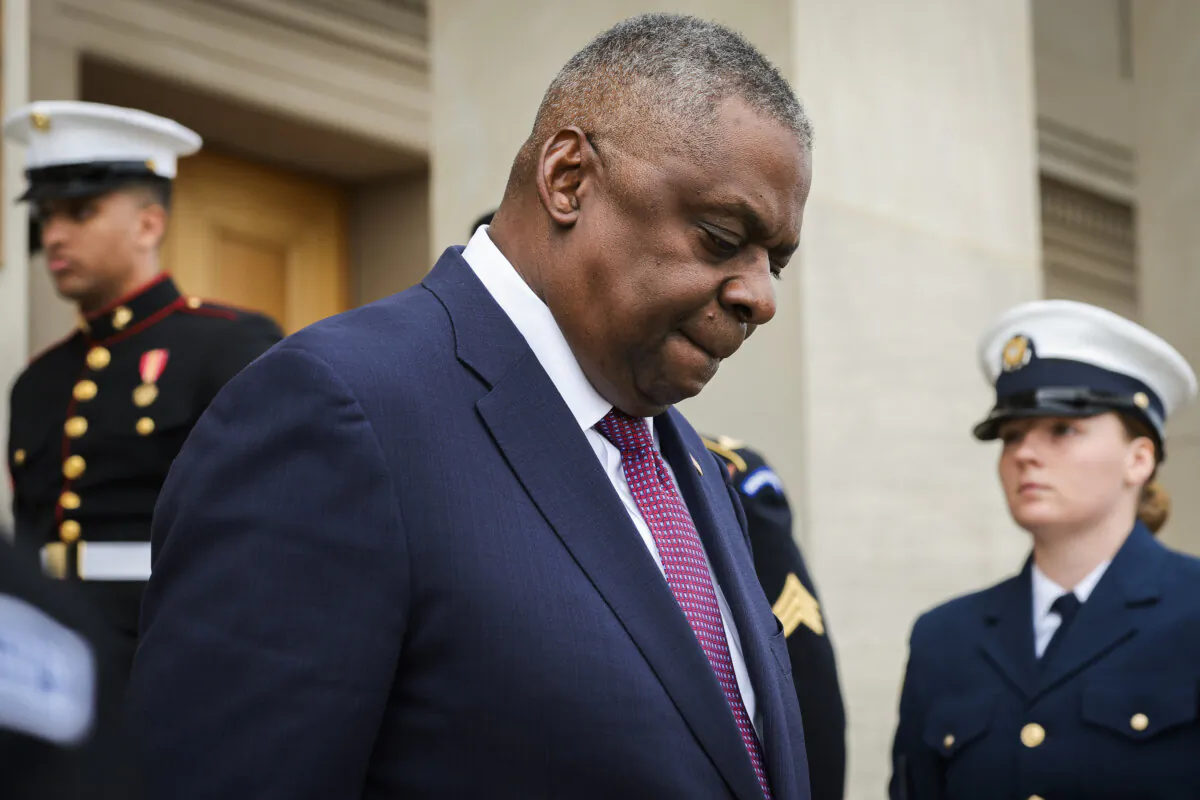 U.S. Secretary of Defense Lloyd Austin walks down the steps of the Pentagon to greet Romanian Prime Minister Marcel Ciolacu on Dec. 4, 2023, in Arlington, Va. (Win McNamee/Getty Images)