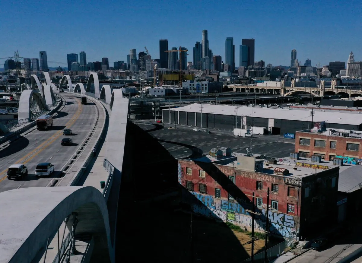 An aerial image shows vehicles driving across the 6th Street Viaduct toward the downtown Los Angeles skyline in Los Angeles on Feb. 8, 2023. (Patrick T. Fallon/AFP via Getty Images)