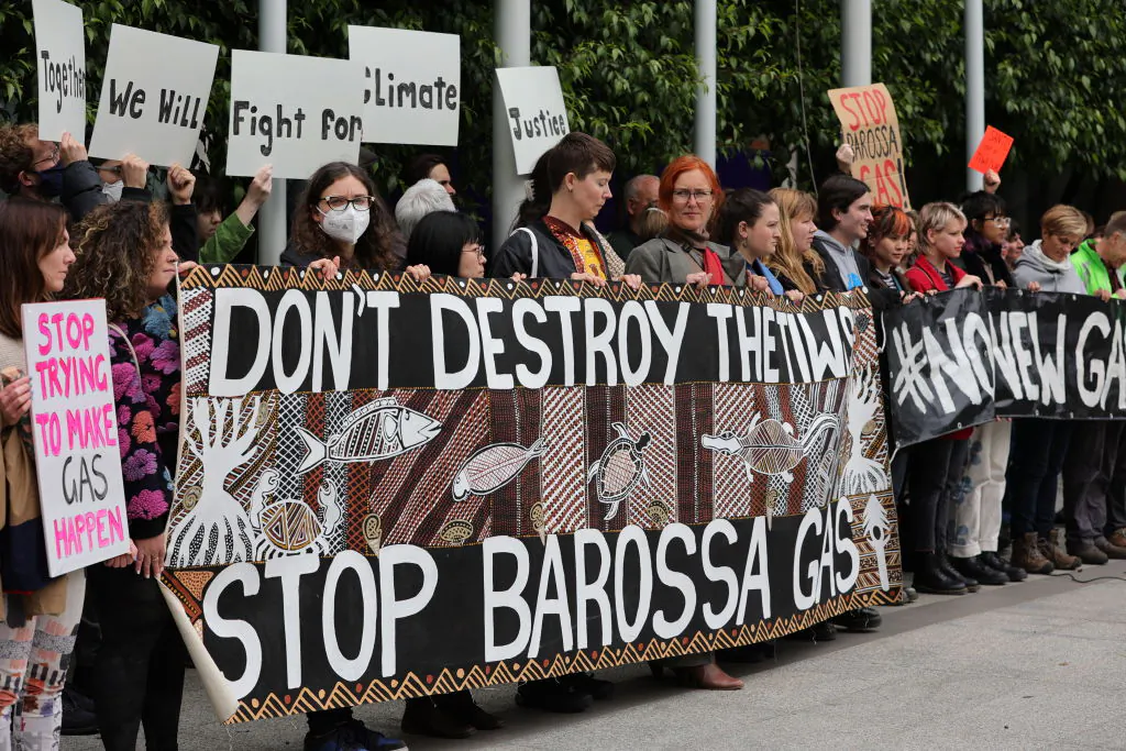 Protesters gather at the front of the Federal Court of Australia in Melbourne, Australia on Nov. 15, 2022. This case involves Santos Ltd., and the major Barossa Gas project, located near the Tiwi Islands off the northern coast of Australia. (Tamati Smith/Getty Images)