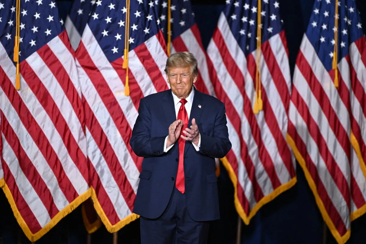 Former President and Republican presidential hopeful Donald Trump applauds at a watch party during the 2024 Iowa Republican presidential caucuses in Des Moines, Iowa, on Jan. 15, 2024. (Jim Watson/AFP via Getty Images)