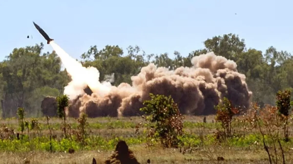 A M142 High Mobility Artillery Rocket System (HIMARS) fires a missile in Australia's Northern Territory. (Courtesy of Australian Department of Defence)