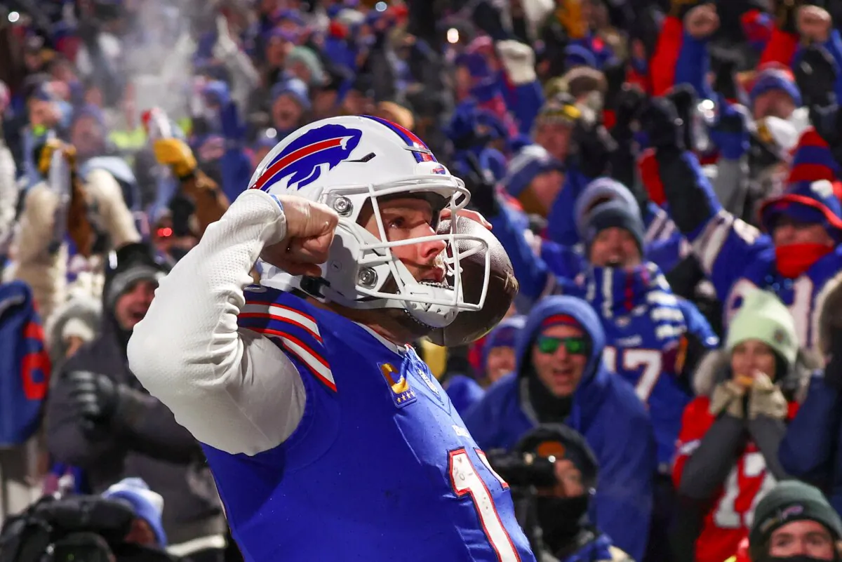 Buffalo Bills quarterback Josh Allen (17) reacts to the crowd after scoring a touchdown against the Pittsburgh Steelers during the second quarter of an NFL wild-card playoff football game in Buffalo, N.Y., on Jan. 15, 2024. (Adrian Kraus/AP Photo)