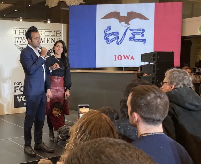 Vivek Ramaswamy, with his wife, Apoorva, and son, Karthik, announces at the Surety Hotel in downtown Des Moines, Iowa, that he's ending his presidential campaign after a fourth-place finish in the Iowa caucuses on Jan. 15, 2024. (John Haughey/The Epoch Times)