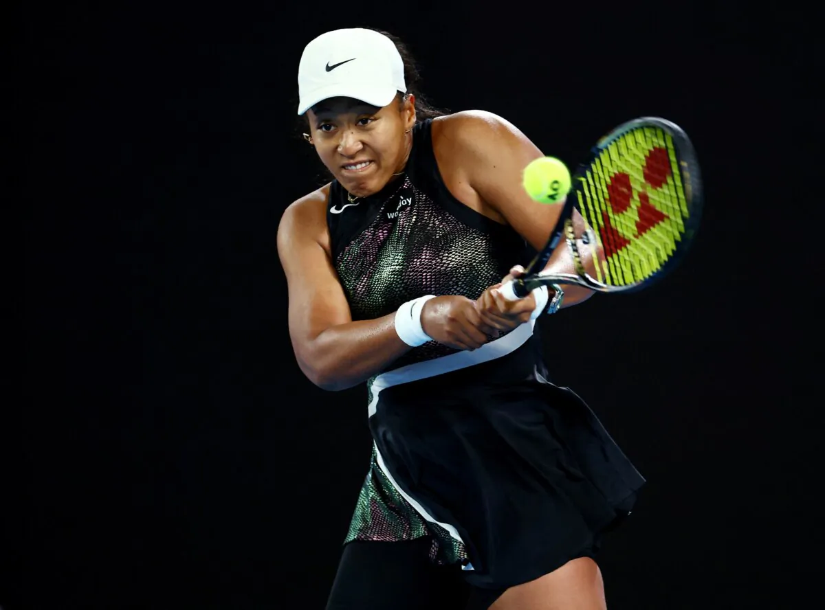 Japan's Naomi Osaka in action during her first round match against France's Caroline Garcia in Australian Open, at Melbourne Park, Melbourne, Australia, on Jan. 15, 2024. (Edgar Su/Reuters)