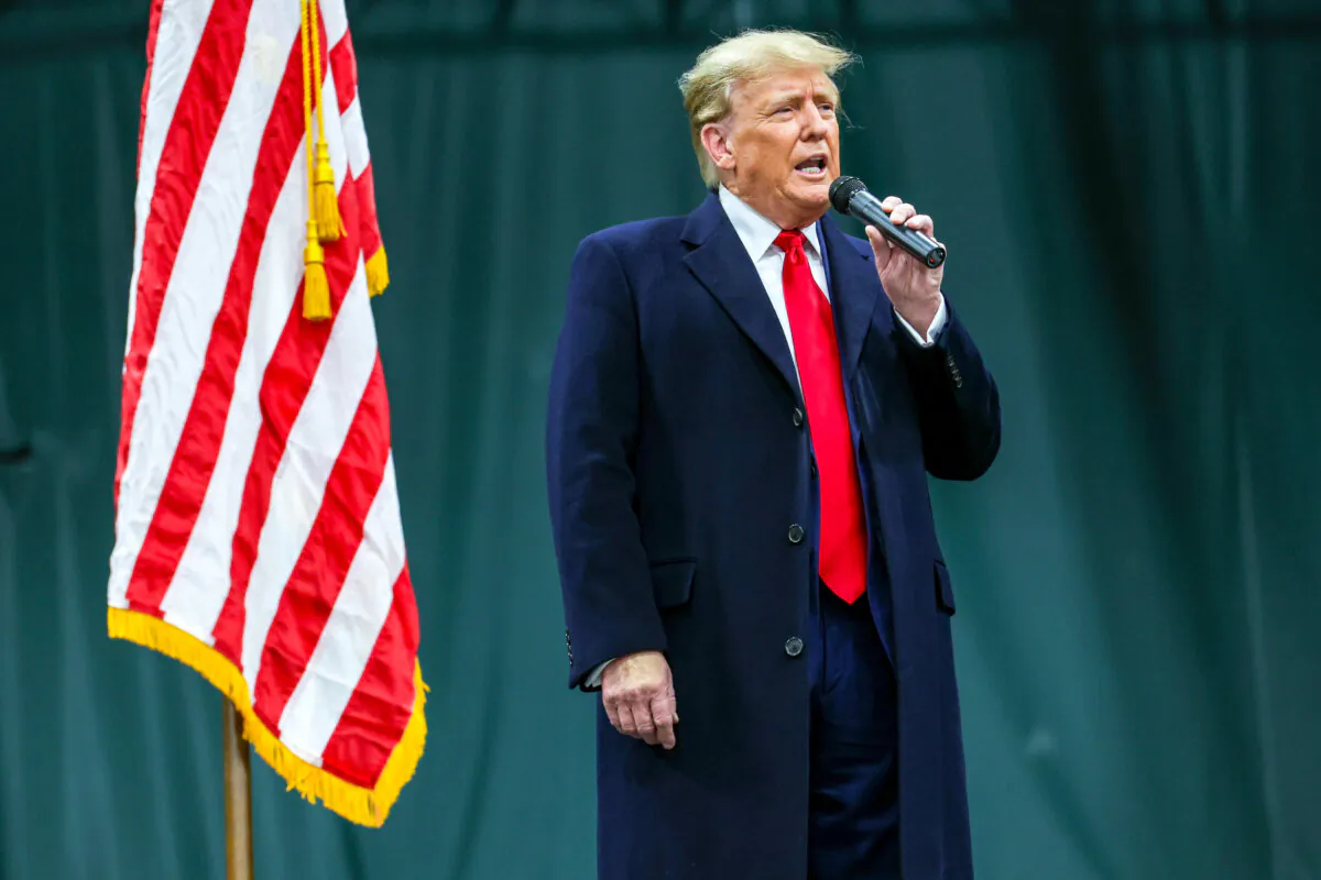 Former President Donald Trump speaks to voters during a visit to a caucus site at the Horizon Event Center in Clive, Iowa, on Jan. 15, 2024. (Kevin Dietsch/Getty Images)
