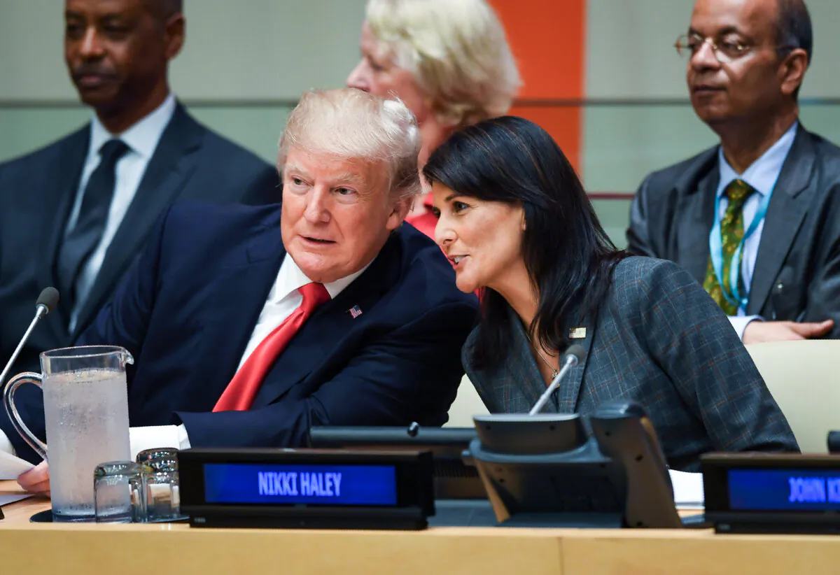 President Donald Trump and U.S. ambassador to the United Nations Nikki Haley (R) speak during a meeting on United Nations Reform at the United Nations headquarters in New York on Sept. 18, 2017. (Timothy A. Clary/AFP/Getty Images)