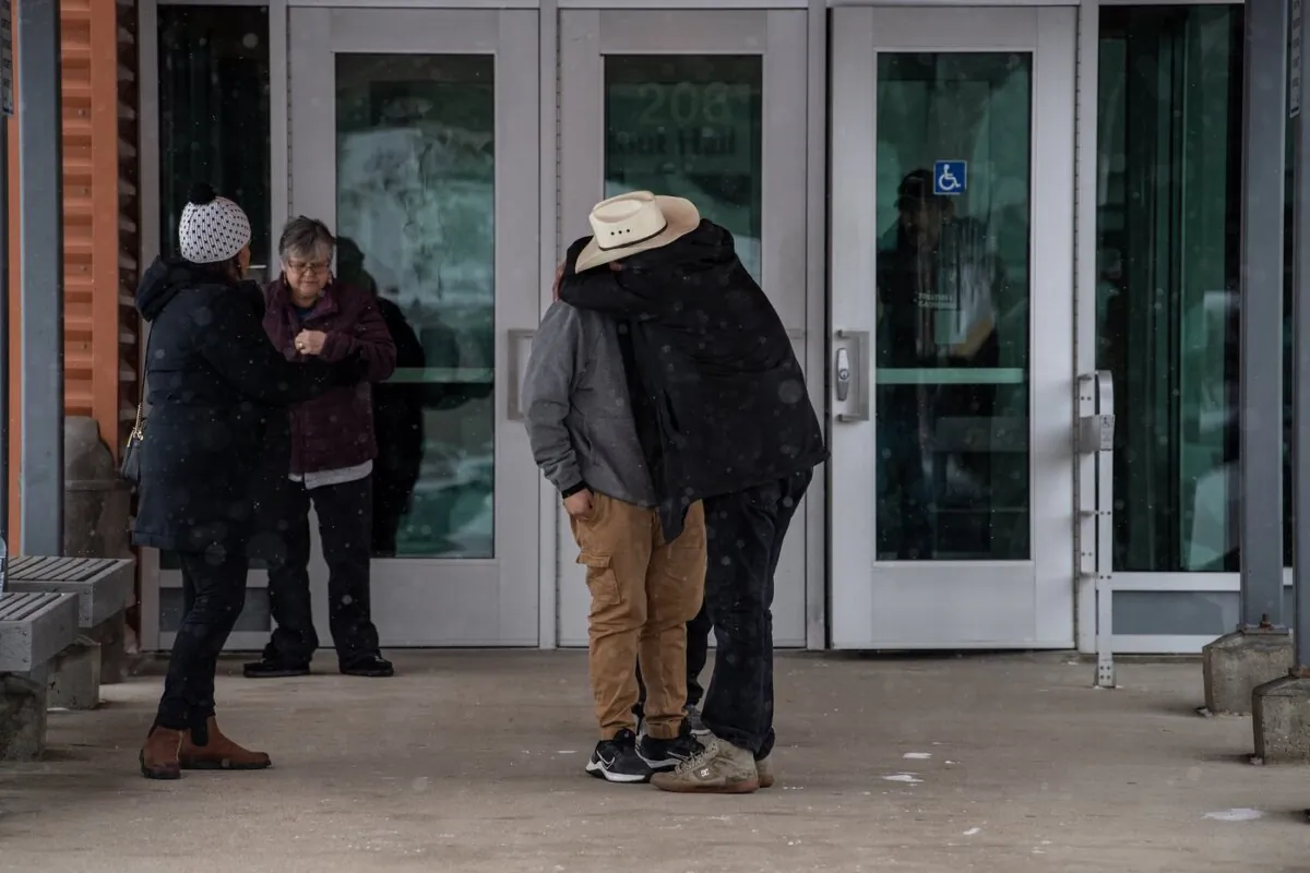 People comfort each other during a lunch break at the public coroner's inquest into the mass stabbings that happened on James Smith Cree Nation in 2022 in Melfort, Sask., on Jan. 16, 2024. (The Canadian Press/Liam Richards)