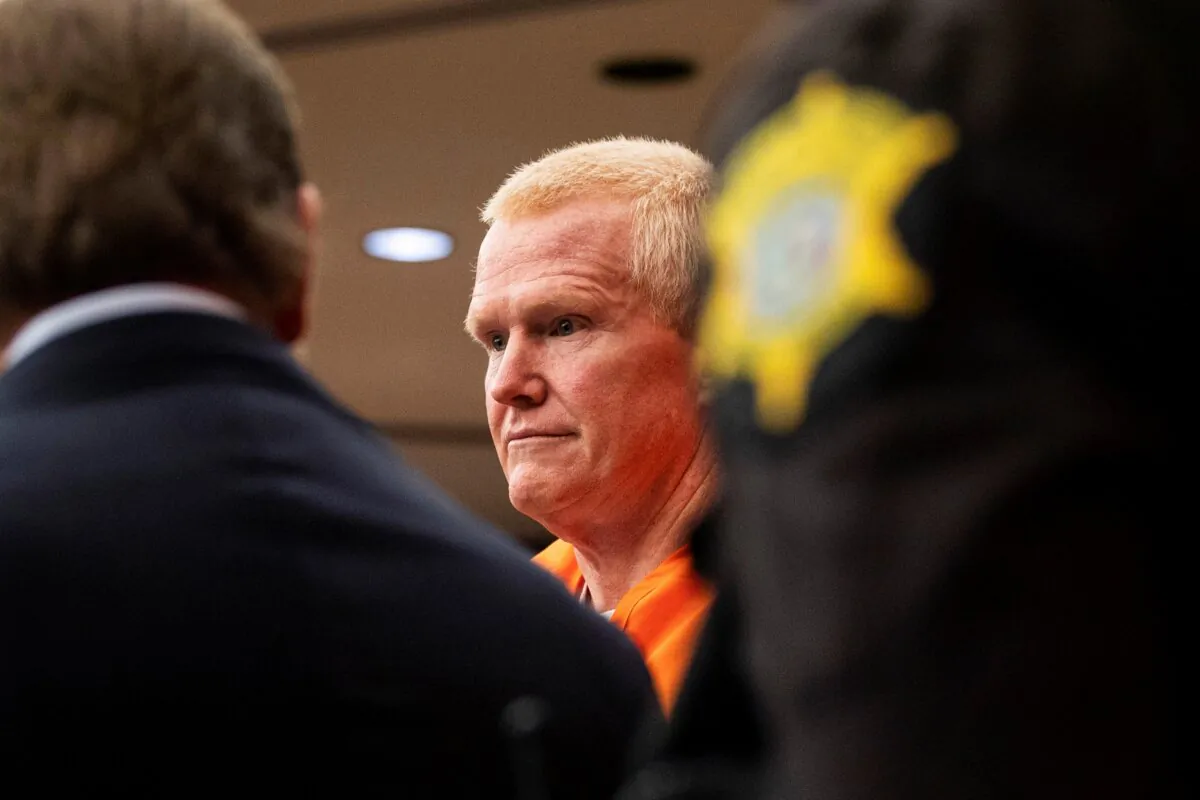 Alex Murdaugh, convicted of killing his wife, Maggie, and younger son, Paul, in June 2021, is escorted into the courtroom for a hearing on the motion for a retrial at the Richland County Judicial Center, in Columbia, S.C., on Jan. 16, 2024. (Gavin McIntyre/The Post and Courier via AP, Pool)