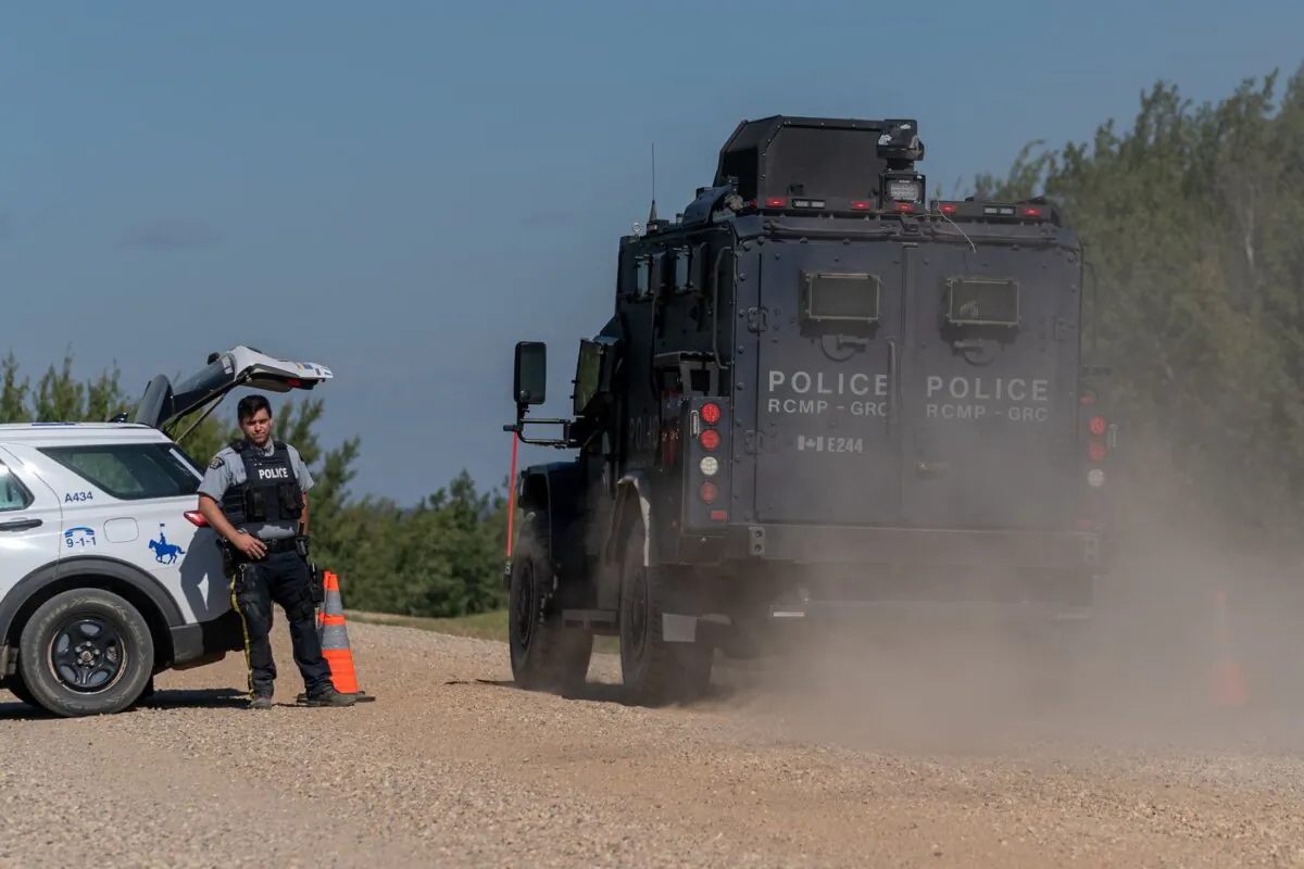 A Tactical Armoured RCMP Vehicle drives past a police road block set up in James Smith Cree Nation, Sask., on Sept. 6, 2022. (The Canadian Press/Heywood Yu)