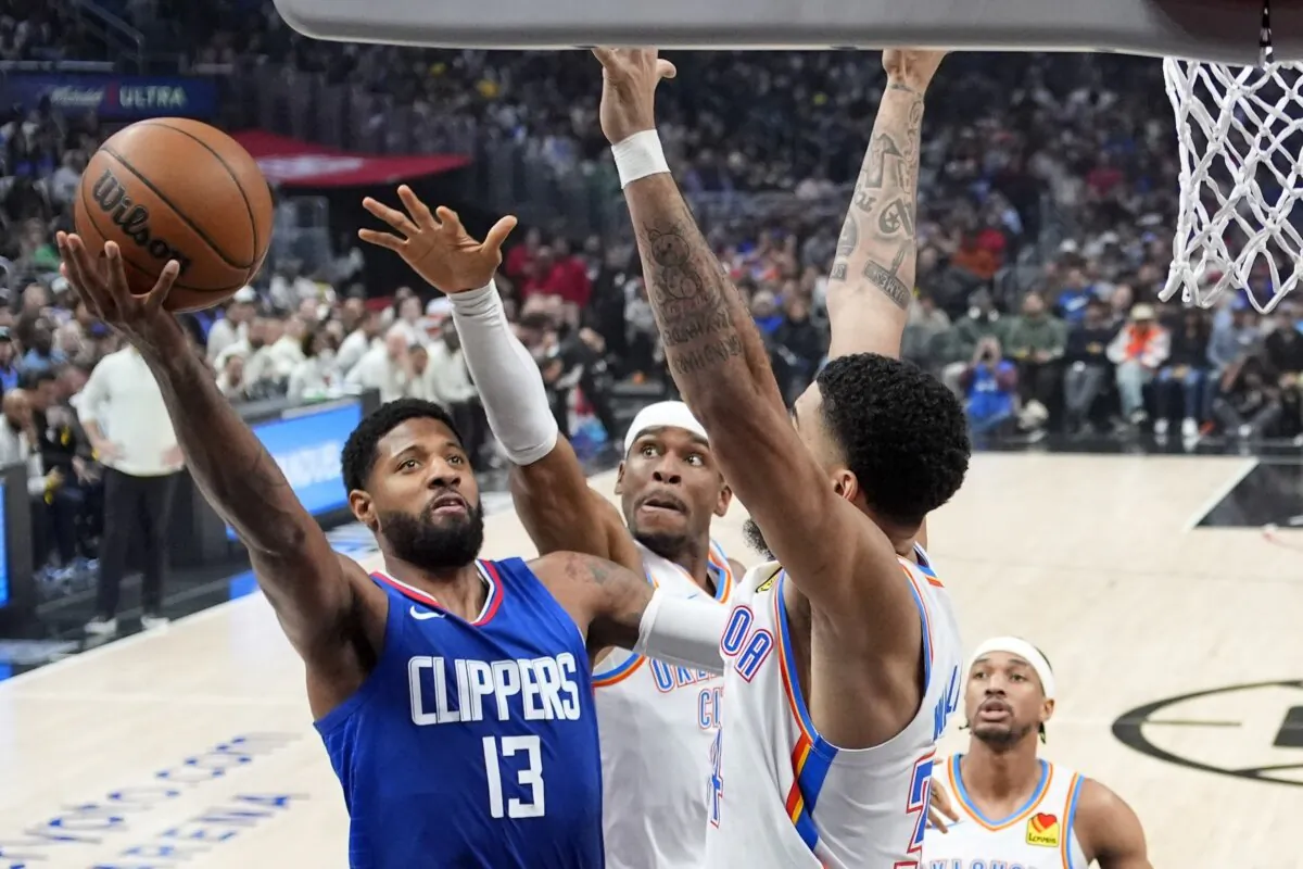 Los Angeles Clippers forward Paul George (L) shoots as Oklahoma City Thunder guard Shai Gilgeous-Alexander, center and forward Kenrich Williams defend during the first half of an NBA basketball game in Los Angeles on Jan. 16, 2024. (Mark J. Terrill/AP Photo)