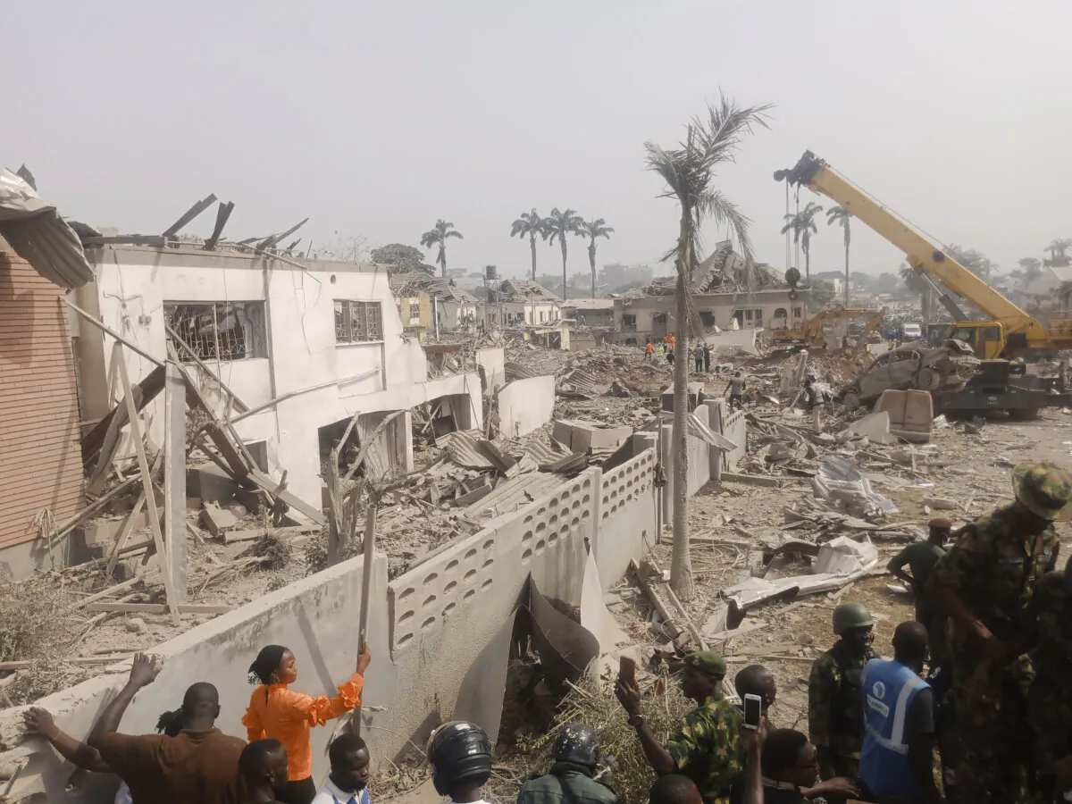 People gather at the site of an explosion in Ibadan, Nigeria, on Jan. 17, 2024. (AP Photo)